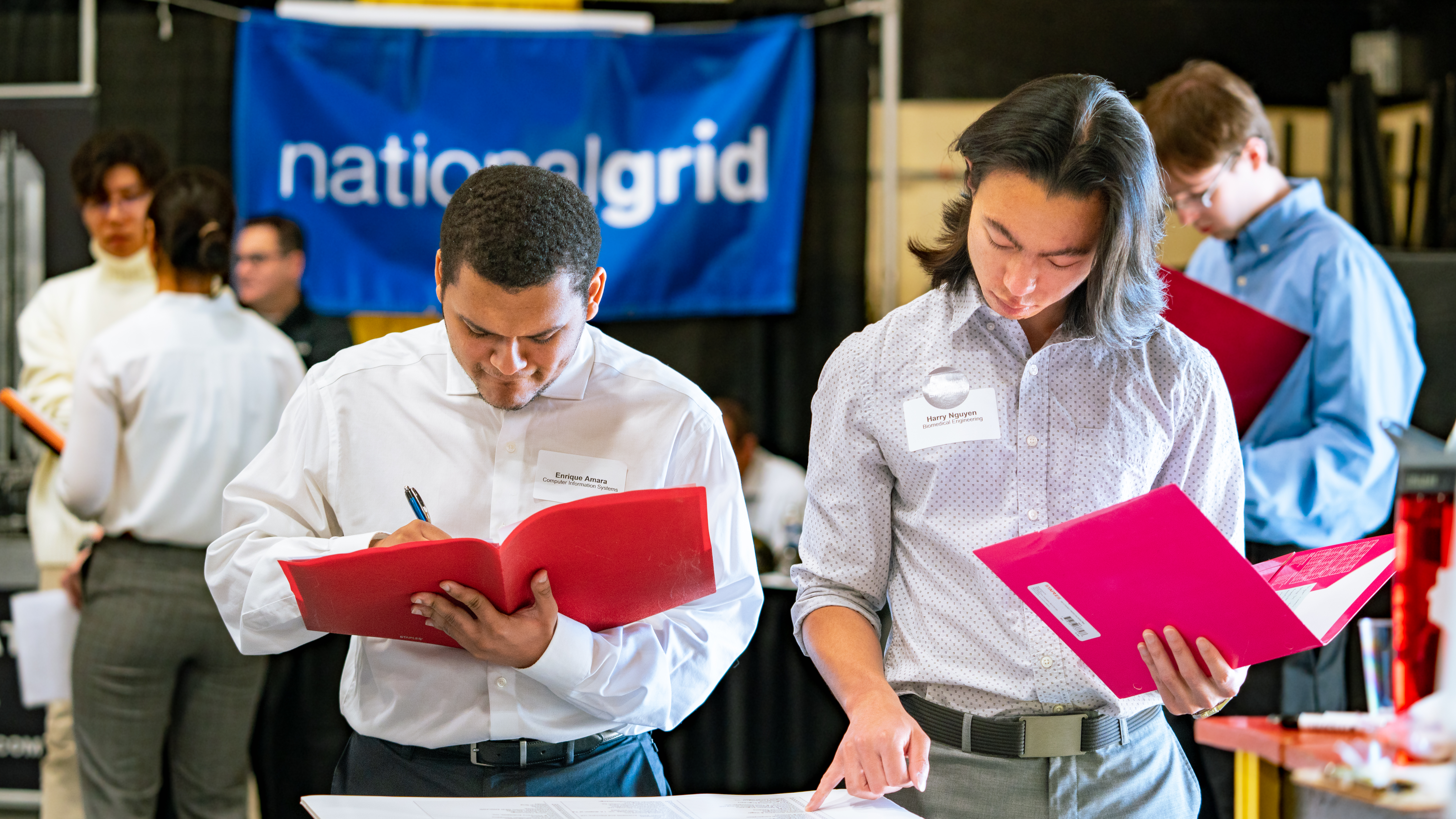 two students looking at resumes