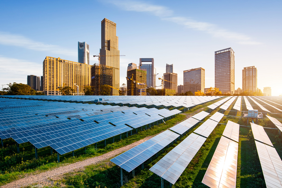 solar panels with city skyline in the background