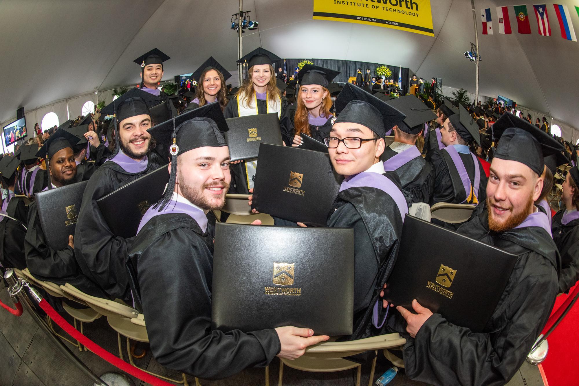 wentworth students posing with diplomas