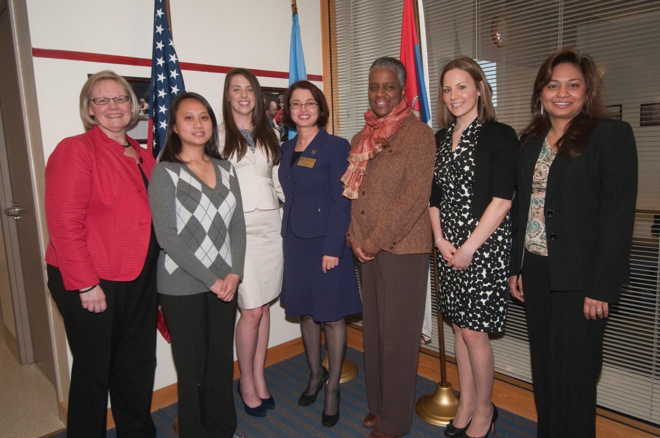 Faculty and staff gathering together for a photo