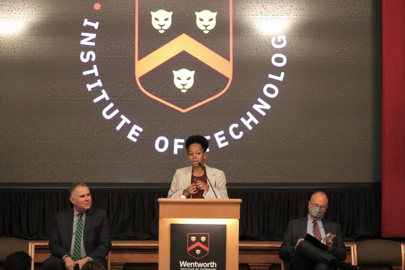 woman speaking at a podium