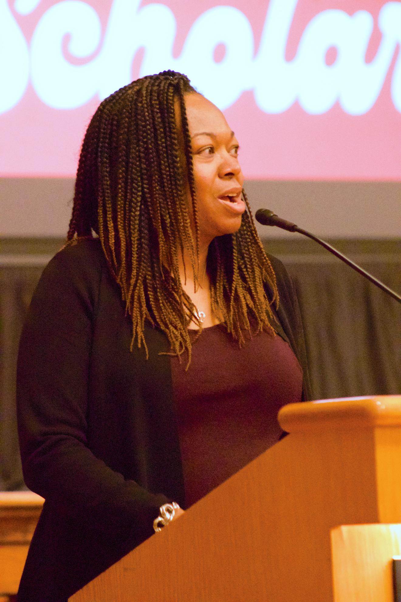 woman speaking into microphone