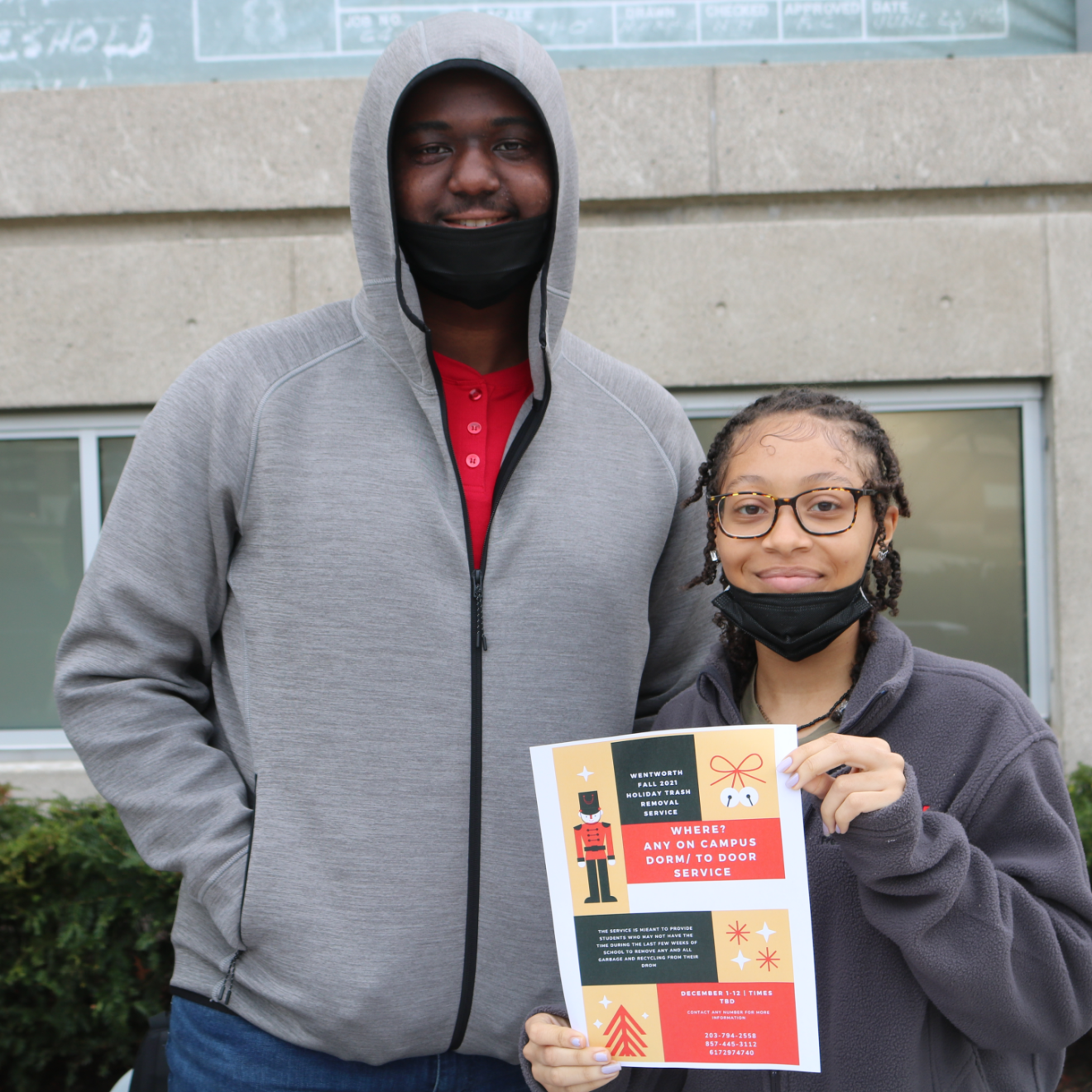 two people posing outside