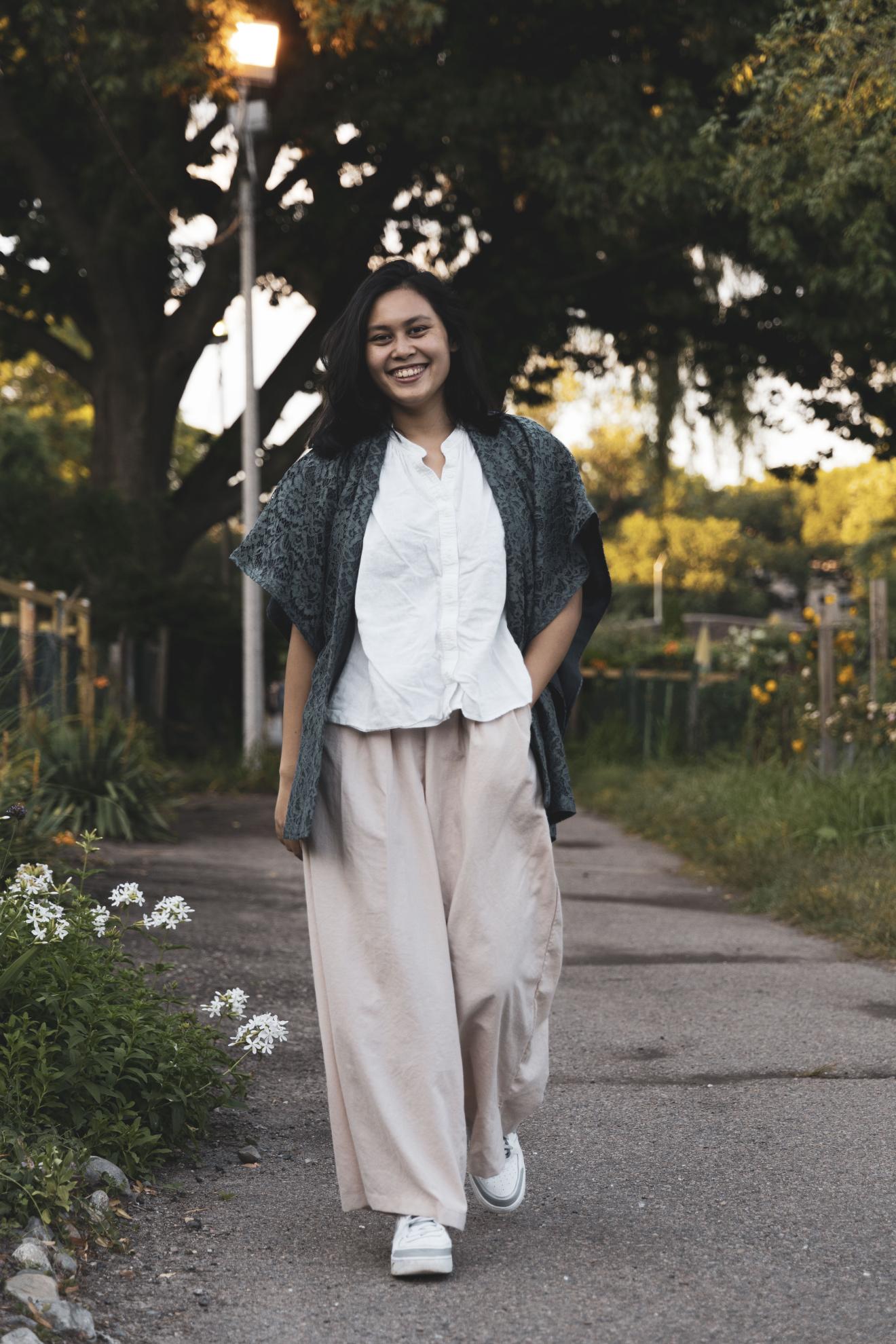 woman walking down sidewalk