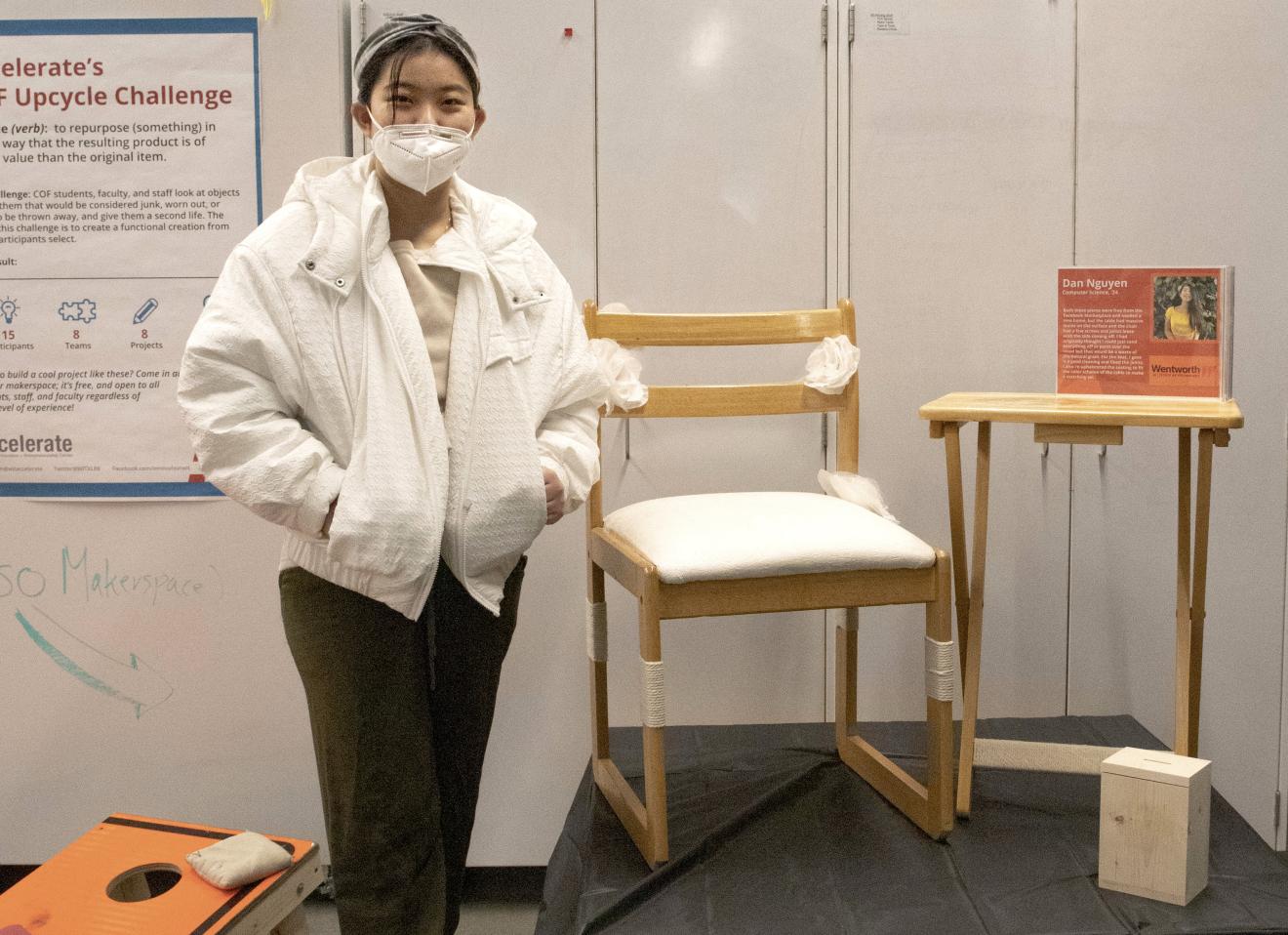 person standing with chair and table