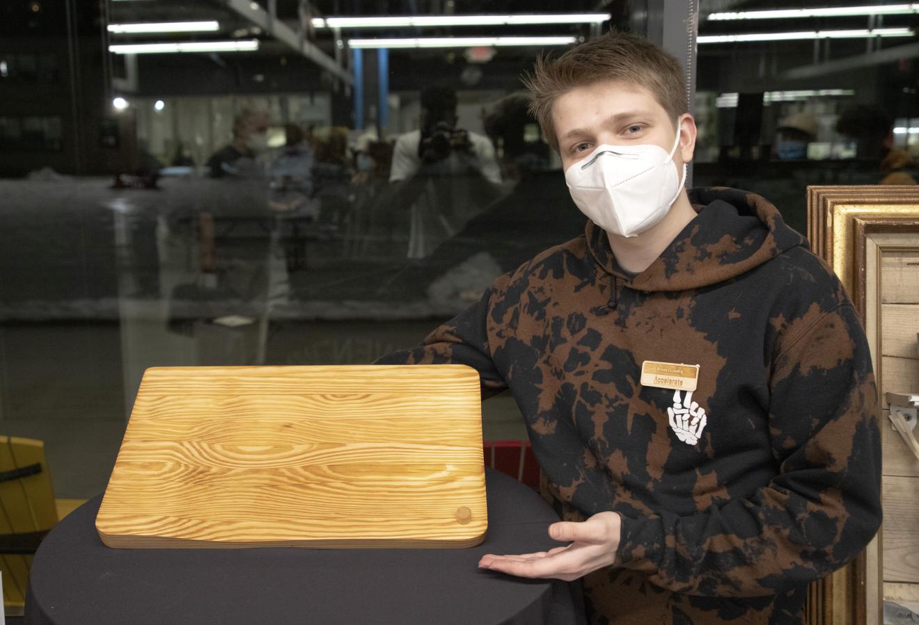 person holding up cutting board