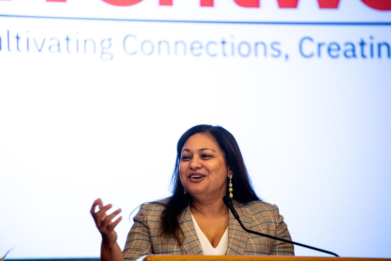 woman speaking at a podium