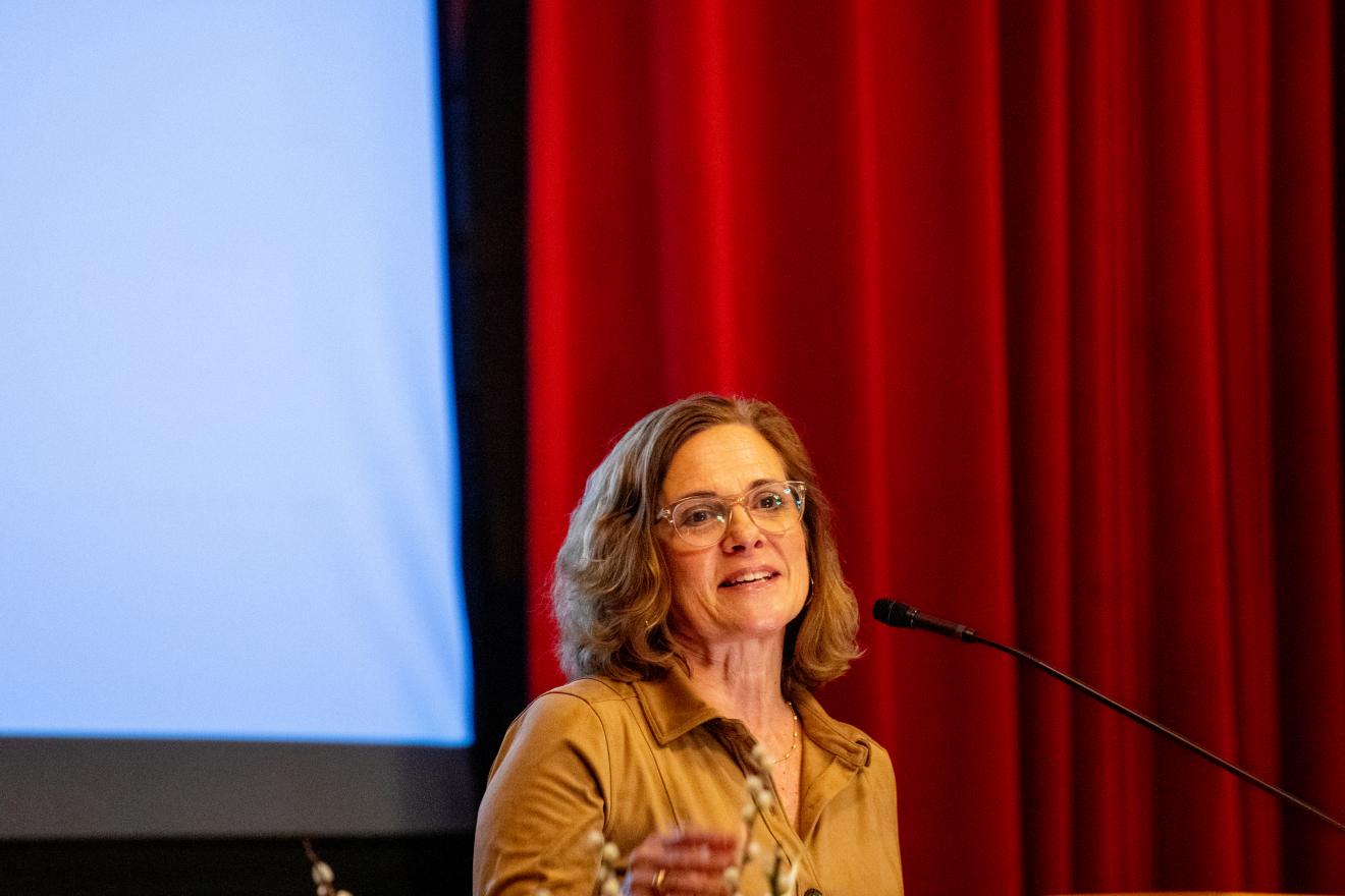 woman speaking at a podium