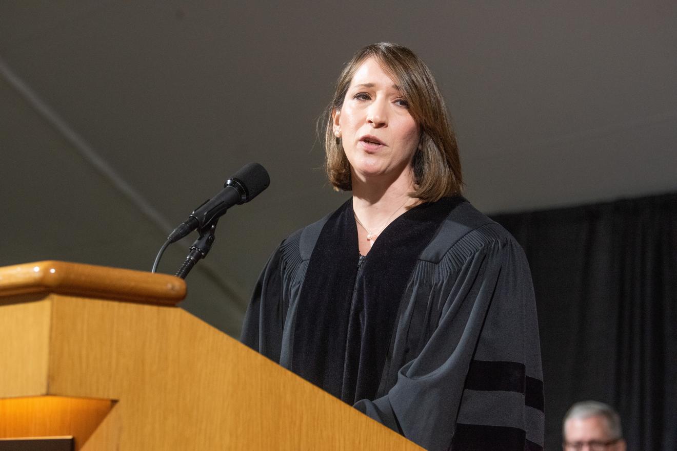 a woman speaking at a podium