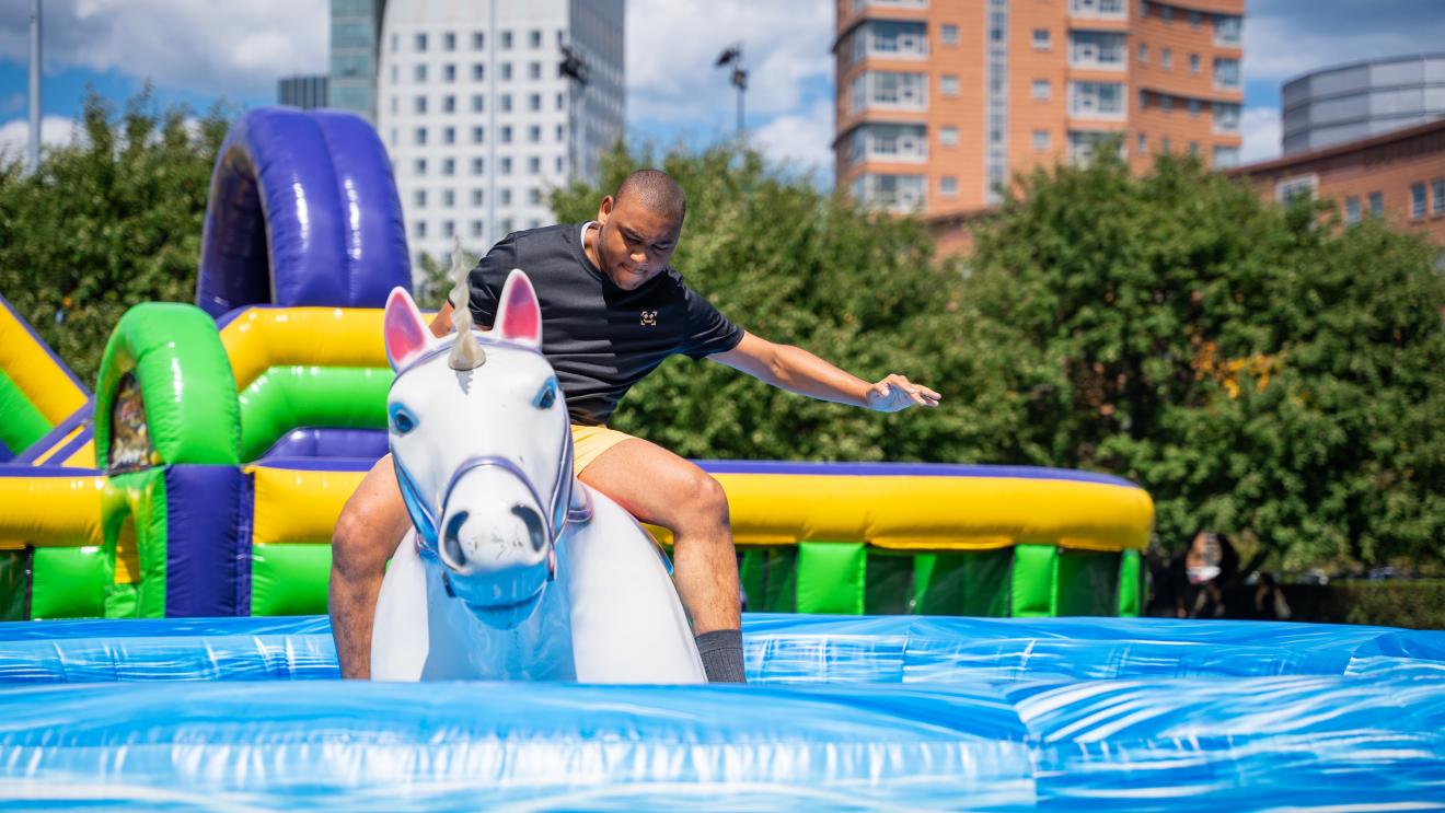 person riding a mechanical unicorn