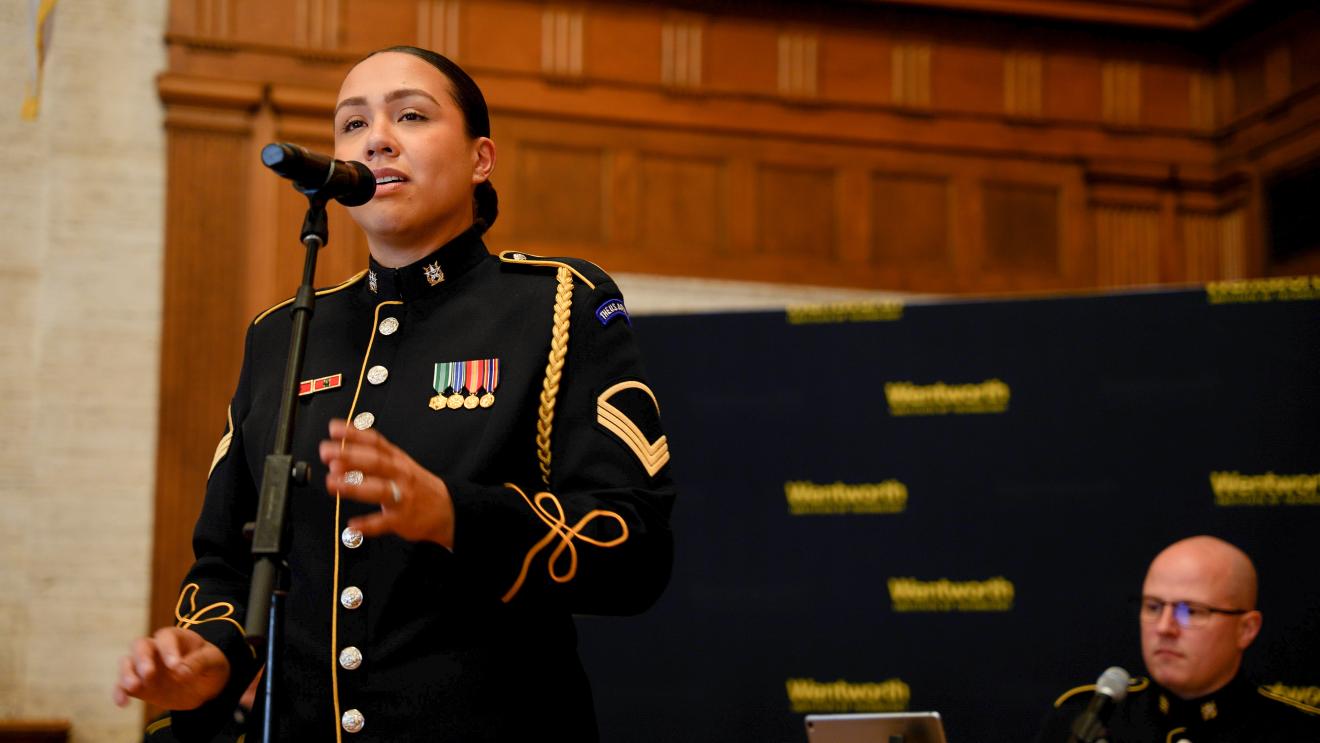 woman singing into a microphone