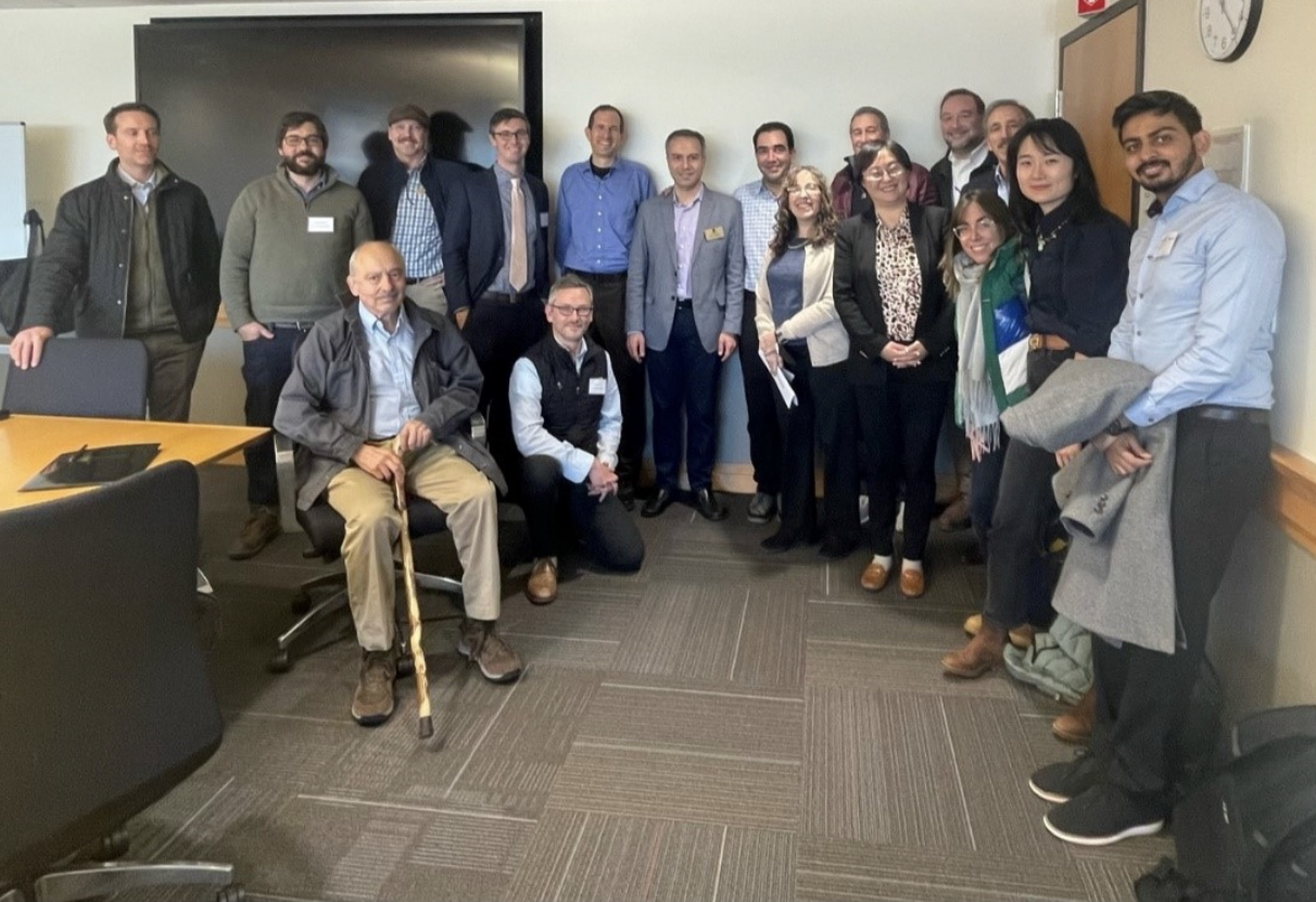 group of people posing in a conference room