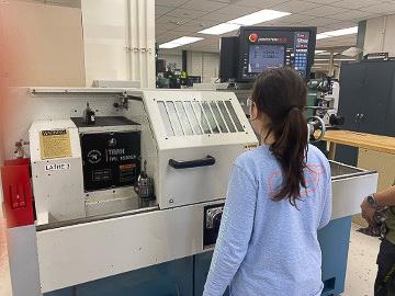 girl using a machine in university lab