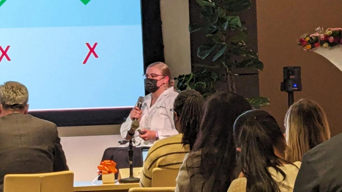 woman presenting at a public event