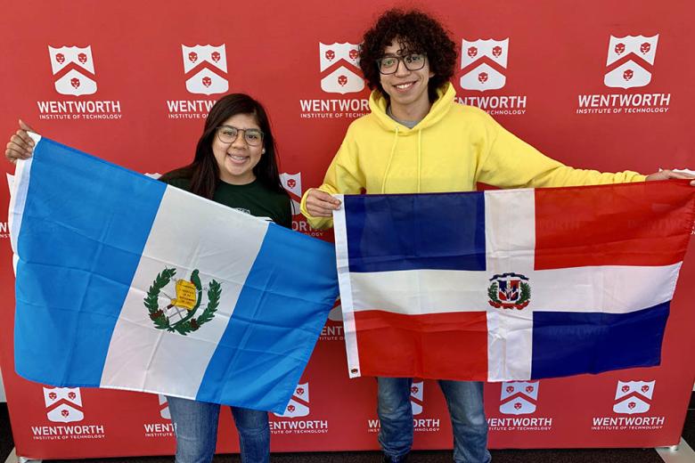 International students showing off their home country flags