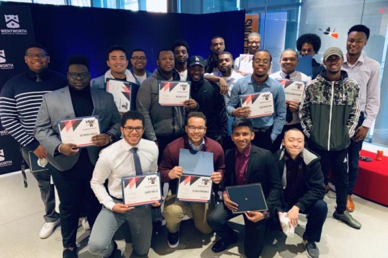 Students posing with certificates