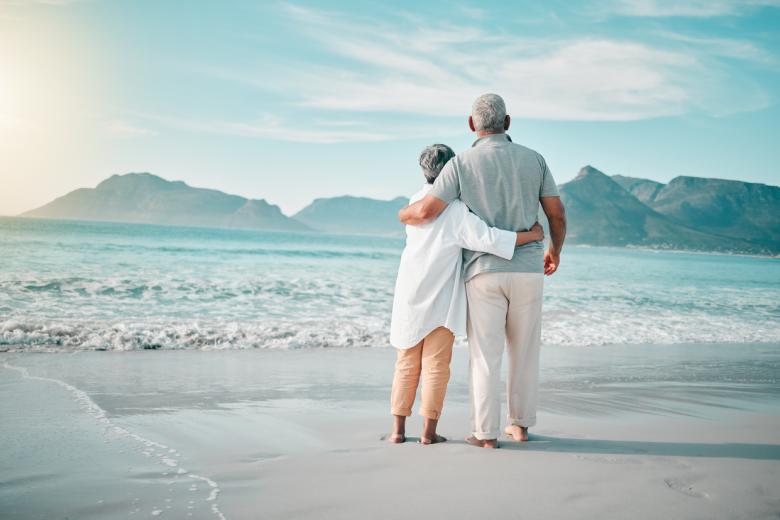 retired couple on beach