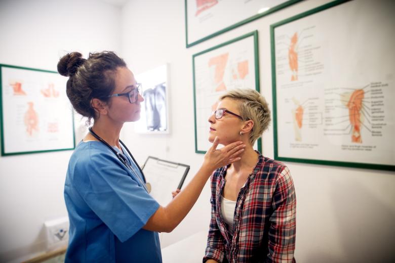 patient getting checkup from doctor