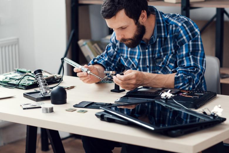 man soldering