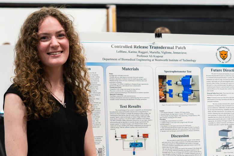 Jennavieve Viglione stands in front of her poster entitled "Controlled Release Transdermal Patch" at the Engineering student showcase