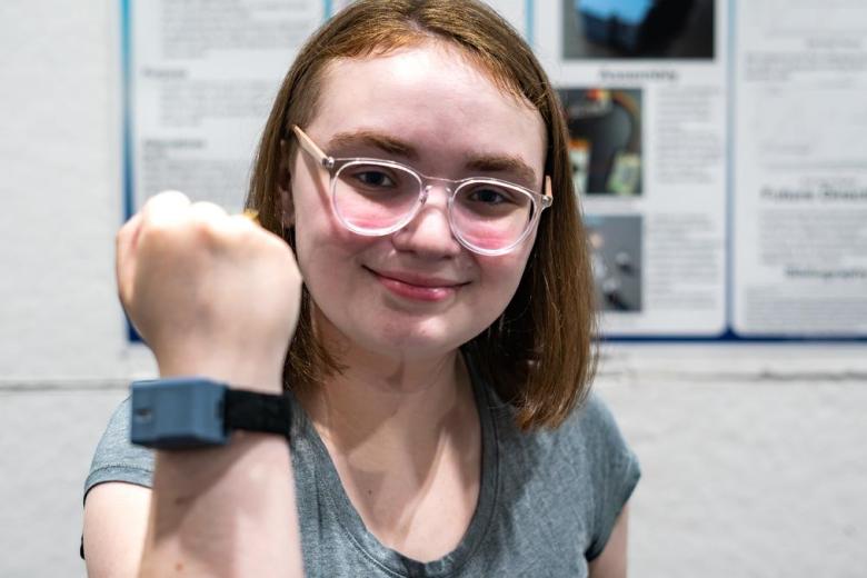 Sky Wildhund with her wrist wearable for sensing VR