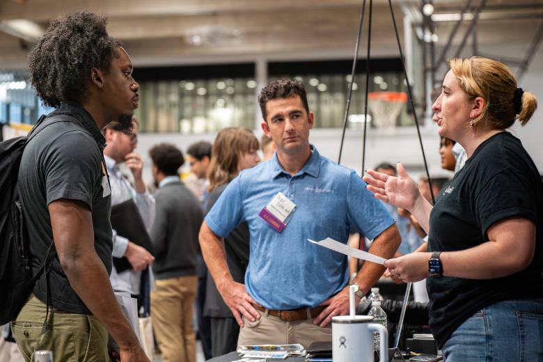 people having a conversation at a career fair