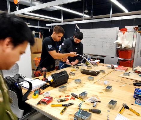 students at a worktable 