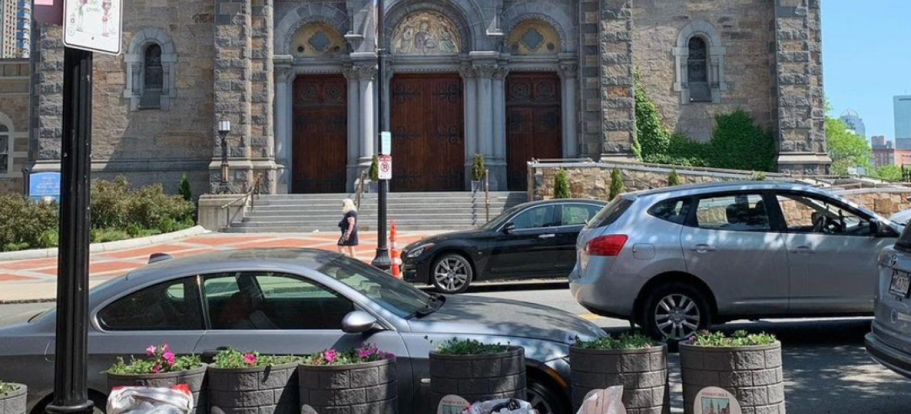 flowers planters in front of a city church