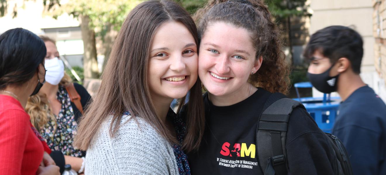 two women posing for camera