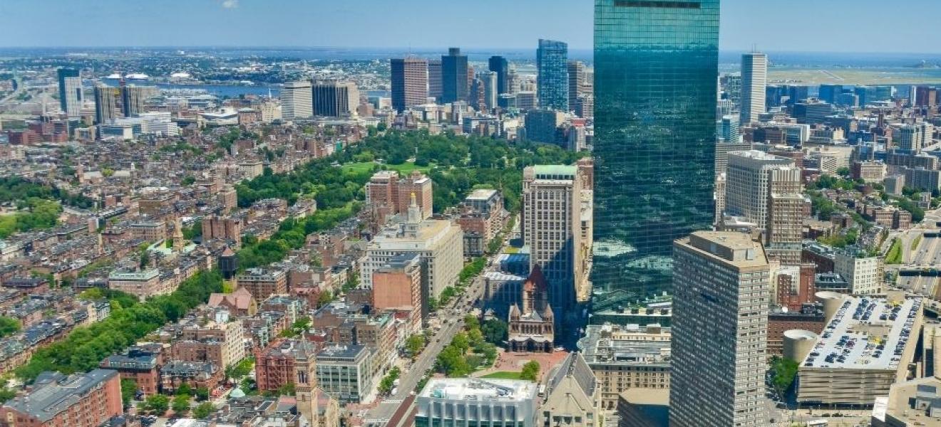 aerial shot of a city with tall buildings