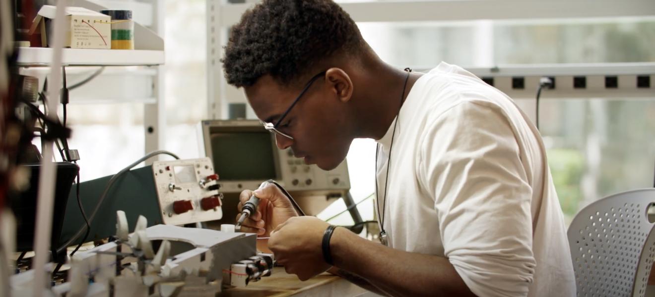 a man works on lab equipment