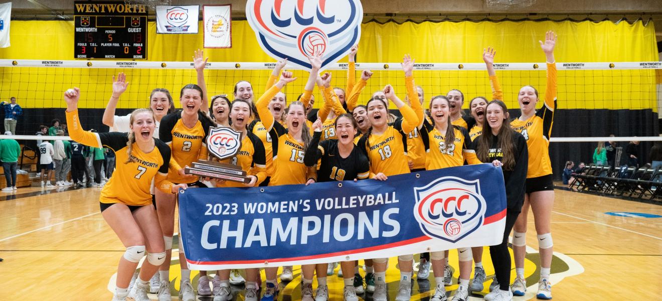 women celebrate on a volleyball court after a win