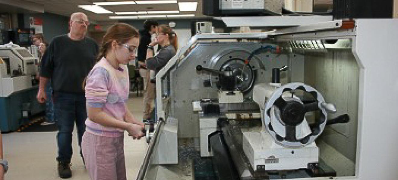 girl using a machine in university lab