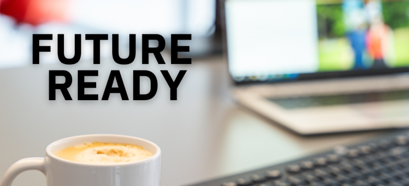 mug and laptop on a desk