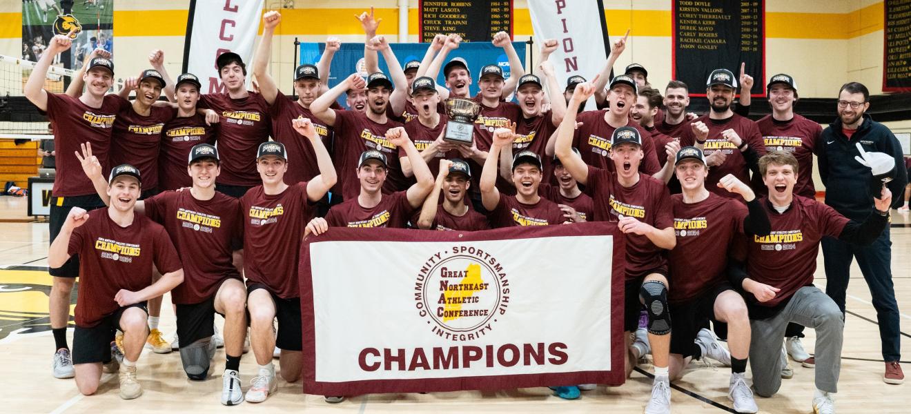 a volleyball team celebrates a victory